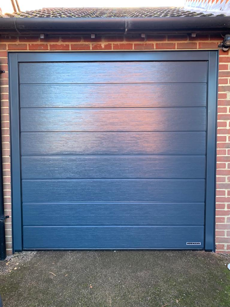 Hormann LPU 42 M-Ribbed Woodgrain Sectional Door